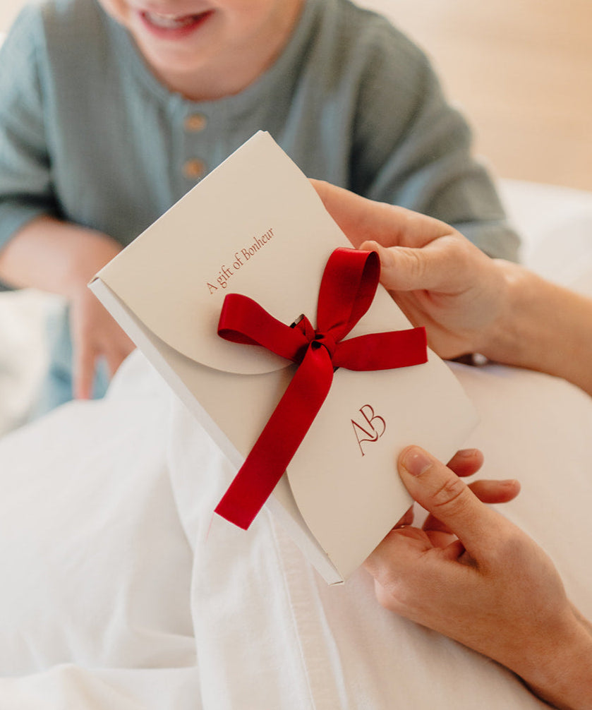 Atelier Bonheur Cadeaubon met strik.