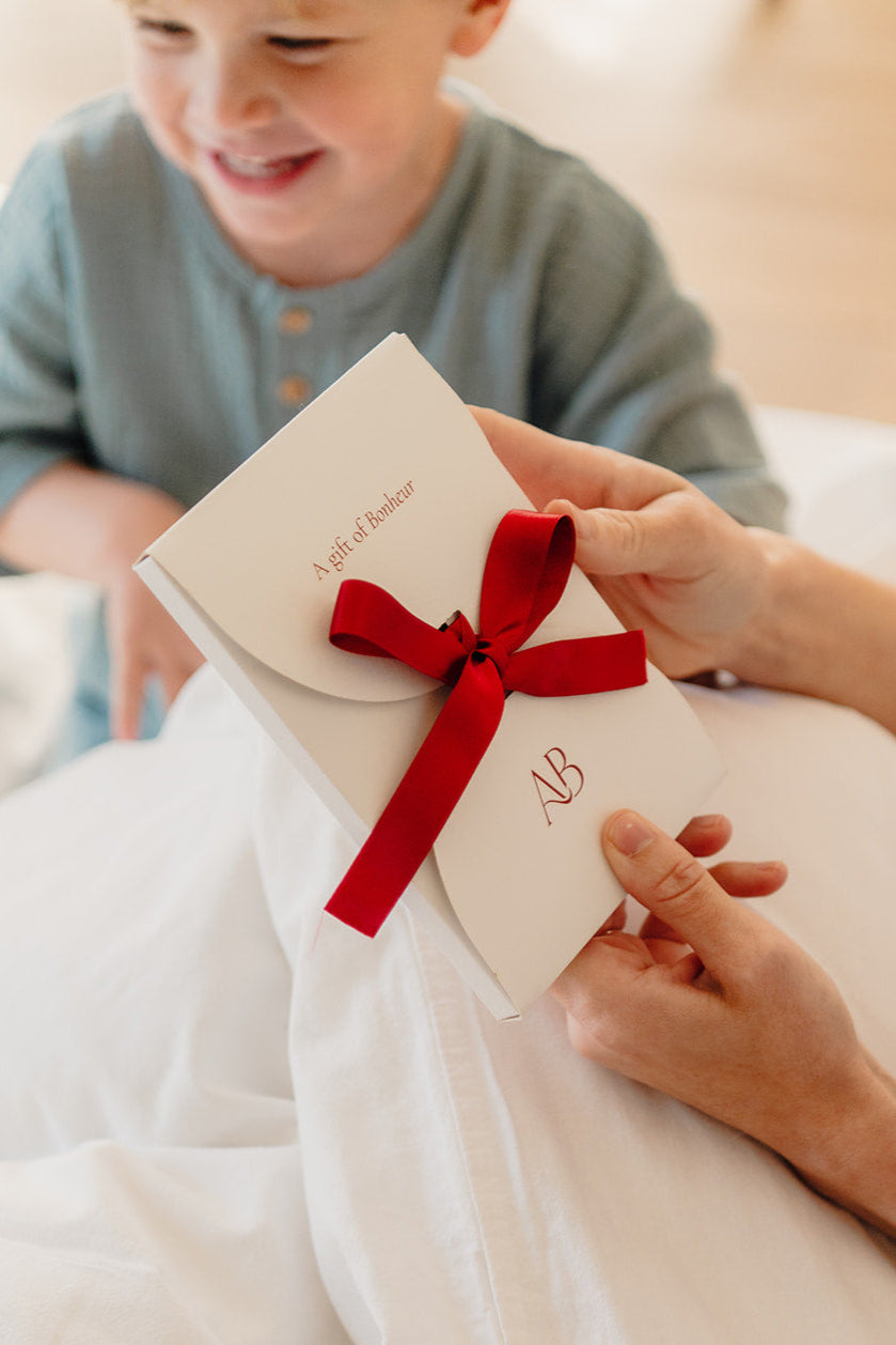 Atelier Bonheur Cadeaubon met strik.